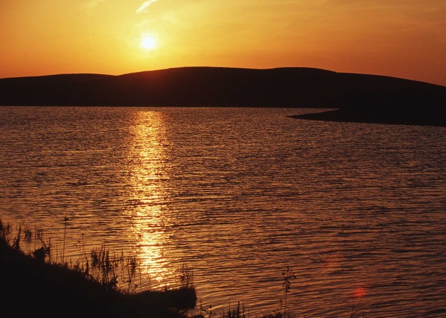 Sunset above the waters of the State of South Dakota, USA. Photo Credit: Don Poggensee (2001, State of South Dakota, USA, http://photogallery.nrcs.usda.gov, NRCSSD01054), USDA Natural Resources Conservation Service (NRCS, http://www.nrcs.usda.gov), United States Department of Agriculture (USDA, http://www.usda.gov), Government of the United States of America (USA).
