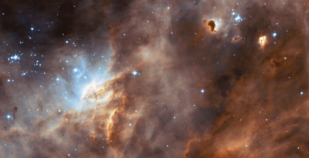 N11B Located in the Large Magellanic Cloud (LMC)--160,000 Light-years From Earth. Photo Credit: N11B located in the Large Magellanic Cloud (LMC), July 1, 2004, STScI-2004-22, NASA's Earth-orbiting Hubble Space Telescope; European Space Agency (ESA, http://www.esa.int), The Hubble Heritage Team (AURA/STScI, http://HubbleSite.org), National Aeronautics and Space Administration (NASA, http://www.nasa.gov), Government of the United States of America (USA). Acknowledgment: Y.-H. Chu (University of Illinois, Urbana-Champaign, Illinois, USA) and Y. Naz (U. Lige, Belgium).