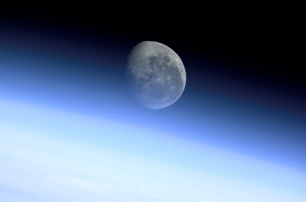 Earth (bottom), its Luminous Blue Protective Envelope of Gases Known as the Limb (middle), and the Moon (at top, center). Photo Credit: Atmospheric Limb, Moon, Earth. Sciences and Image Analysis, NASA-Johnson Space Center. 8 December 2003. "Astronaut Photography of Earth - Quick View." <http://eol.jsc.nasa.gov/scripts/sseop/QuickView.pl?directory=ESC&ID=ISS002-E-9767>; National Aeronautics and Space Administration (NASA, http://www.nasa.gov), Government of the United States of America (USA).