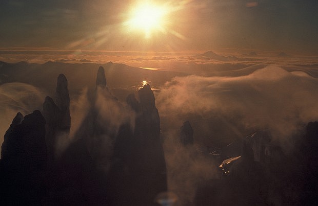 The Sun's Rays Shine on the Misty Aghileen Pinnacles. Izembek National Wildlife Refuge, State of Alaska, USA. Photo Credit: John Sarvis (AK/RO/03150), Alaska Image Library, United States Fish and Wildlife Service Digital Library System (http://images.fws.gov), United States Fish and Wildlife Service (FWS, http://www.fws.gov), United States Department of the Interior (http://www.doi.gov), Government of the United States of America (USA).