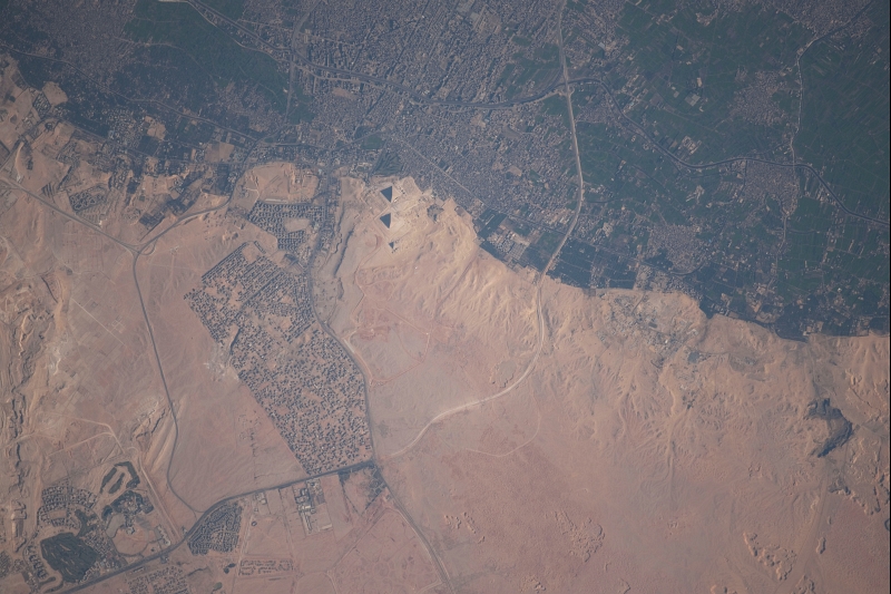 12. El Giza, The Great Pyramids and Cairo, January 24, 2010 at 08:09:12 GMT, Jumhuriyat Misr al-Arabiyah - Arab Republic of Egypt, As Seen From the International Space Station (Expedition Twenty-Two), Latitude (LAT): 30.6, Longitude (LON): 31.3, Altitude (ALT): 182 Nautical Miles, Sun Azimuth (AZI): 147 degrees, Sun Elevation Angle (ELEV): 33 degrees. Photo Credit: NASA; ISS022-E-36022, El Giza, The Great Pyramids, Cairo, International Space Station (Expedition Twenty-Two); Image Science and Analysis Laboratory, NASA-Johnson Space Center. 'Astronaut Photography of Earth - Display Record.' <http://eol.jsc.nasa.gov/scripts/sseop/photo.pl?mission=ISS022&roll=E&frame=36022>; National Aeronautics and Space Administration (NASA, http://www.nasa.gov), Government of the United States of America (USA).