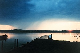 3. A Small Rain Storm and Sunset Across the Patuxent River, April 1992. State of Maryland, USA. Photo Credit: Mary Hollinger, NODC Biologist, NOAA, National Oceanic and Atmospheric Administration Photo Library (http://www.photolib.noaa.gov), America's Coastlines Collection, National Oceanic and Atmospheric Administration (NOAA, http://www.noaa.gov), United States Department of Commerce (http://www.commerce.gov), Government of the United States of America (USA).
