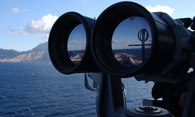 Using Powerful Binoculars the Sailor Keeps a Close Lookout, October 31, 2004, Straits of Gibraltar. Photo Credit: Photographer's Mate Airman Lilliana Lavende, Navy NewsStand - Eye on the Fleet Photo Gallery (http://www.news.navy.mil/view_photos.asp, 041031-N-2805L-243), United States Navy (USN, http://www.navy.mil), United States Department of Defense (DoD, http://www.DefenseLink.mil or http://www.dod.gov), Government of the United States of America (USA).