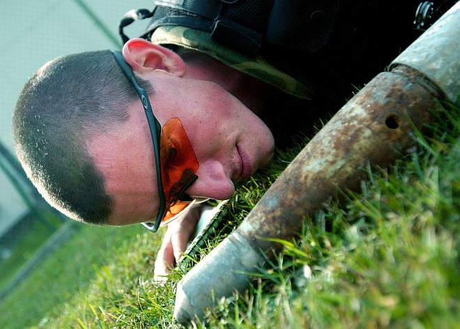 Patience, Carefulness, and Studiousness are Needed When Working with Dangerous Unxploded Ammunition. Unexploded Ordnance (UXO) Disposal Training at Aviano Air Base, August 24, 2004. Repubblica Italiana - Italian Republic, Photo Credit: Airman 1st Class Scherrie K. Gates, Air Force Link - Photos (http://www.af.mil/photos, 040824-F-5508G-004, "A sharp eye"), United States Air Force (USAF, http://www.af.mil), United States Department of Defense (DoD, http://www.DefenseLink.mil or http://www.dod.gov), Government of the United States of America (USA).