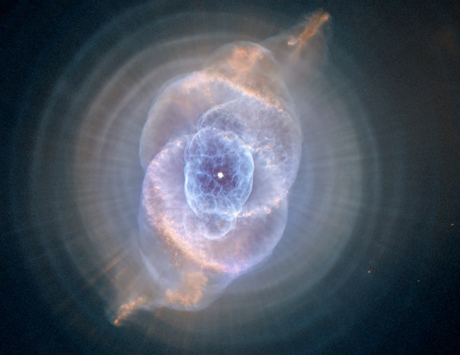 Stunningly Beautiful and Intricate Structures in the Cat's Eye Nebula (NGC 6543), Which Include Concentric Gas Shells, Jets of High-Speed Gas, and Unusual Shock-Induced Knots of Gas. Photo Credit: Dying Star Creates Fantasy-like Sculpture of Gas and Dust, September 9, 2004, STScI-2004-27, NASA's Earth-orbiting Hubble Space Telescope (http://HubbleSite.org); ESA (http://www.SpaceTelescope.org), HEIC, The Hubble Heritage Team (STScI/AURA), and National Aeronautics and Space Administration (NASA, http://www.nasa.gov), Government of the United States of America (USA). Acknowledgment: R. Corradi (Isaac Newton Group of Telescopes, Spain) and Z. Tsvetanov (NASA).