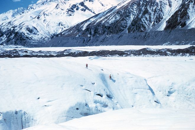 Two Human Explorers Outsized by the Large Crevasse and Large Mountains on this Large Continent, December 1960, Antarctic. Photo Credit: Mr. Ardo X. Meyer, NOAA (ret.), National Oceanic and Atmospheric Administration Photo Library (http://www.photolib.noaa.gov, corp2331), NOAA Corps Collection, National Oceanic and Atmospheric Administration (NOAA, http://www.noaa.gov), United States Department of Commerce (http://www.commerce.gov), Government of the United States of America (USA).