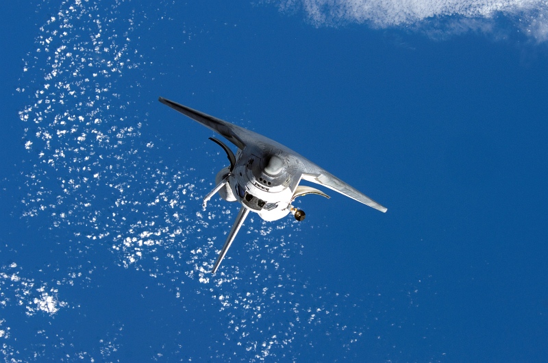 13. Backdropped By White Clouds Over Earth's Blue Waters, Space Shuttle Discovery Approaches the International Space Station, October 25, 2007 As Seen From the International Space Station (Expedition Sixteen). Photo Credit: NASA; STS-120 Shuttle Mission Imagery (http://spaceflight.nasa.gov/gallery/images/shuttle/sts-120/ndxpage1.html): ISS016-E-006333 (http://spaceflight.nasa.gov/gallery/images/shuttle/sts-120/html/iss016e006333.html), NASA Human Space Flight (http://spaceflight.nasa.gov), National Aeronautics and Space Administration (NASA, http://www.nasa.gov), Government of the United States of America.