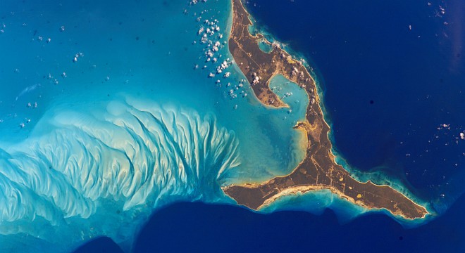 Eleuthera (also Eleuthera Island), Commonwealth of The Bahamas (at right). Photo Credit: International Space Station Image Date: March 16, 2002, South end of the island of Eleuthera, The Bahamas; NASA-Johnson Space Center. 15 December 2004. 'Astronaut Photography of Earth - Display Record.' <http://eol.jsc.nasa.gov/scripts/sseop/photo.pl?mission=ISS004&roll=E&frame=8777>; National Aeronautics and Space Administration (NASA, http://www.nasa.gov), Government of the United States of America (USA). The photo's full size request URL is <http://eol.jsc.nasa.gov/scripts/sseop/LargeImageAccess.pl?directory=ESC/large/ISS004&filename=ISS004-E-8777.JPG&filesize=985764>