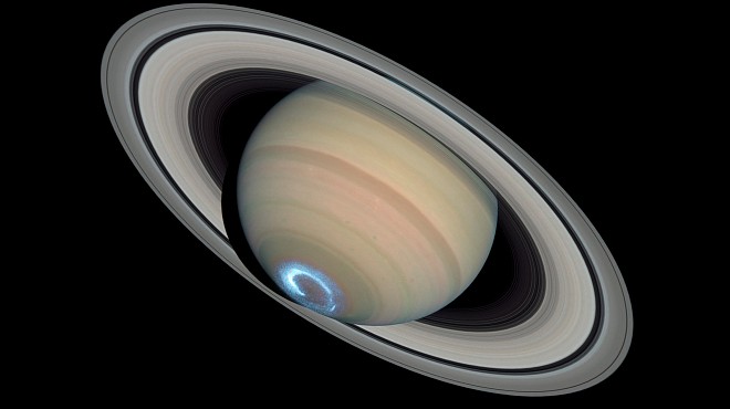 A Grand Scene - Majestic Saturn, Its Stunning Rings, and Beautiful Blue Aurora at the Southern Pole. Photo Credit: Saturn's Dynamic Auroras, January 28, 2004 (ultraviolet image of the aurora) and March 22, 2004 (visible-light image of the planet and rings), STScI-2005-06 (February 16, 2005), NASA's Earth-orbiting Hubble Space Telescope (http://HubbleSite.org); European Space Agency (ESA, http://SpaceTelescope.org), John Clarke (University of Michigan), Z. Levay (STScI), Erich Karkoschka (University of Arizona), National Aeronautics and Space Administration (NASA, http://www.nasa.gov), Government of the United States of America (USA). Acknowledgment: Ray A. Lucas (STScI/AURA).