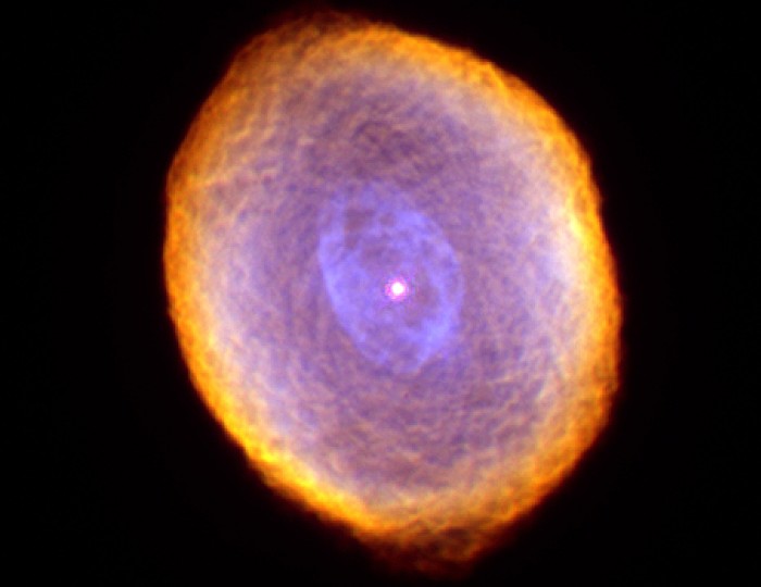 The Spirograph Nebula, IC 418, shown in false-color is about 2,000 light-years from earth towards the constellation Lepus. The white circle at the center is the star, red is ionized nitrogen (the coolest gas), green is hydrogen, and the color blue is ionized oxygen (the hottest gas). Photo Credit: IC 418: The 'Spirograph' Nebula, February and September, 1999 (Released: September 7, 2000), STScI-2000-28, NASA's Earth-orbiting Hubble Space Telescope (http://HubbleSite.org); The Hubble Heritage Team (STScI/AURA), National Aeronautics and Space Administration (NASA, http://www.nasa.gov), Government of the United States of America (USA). Acknowledgment: Dr. Raghvendra Sahai (JPL) and Dr. Arsen R. Hajian (USNO).