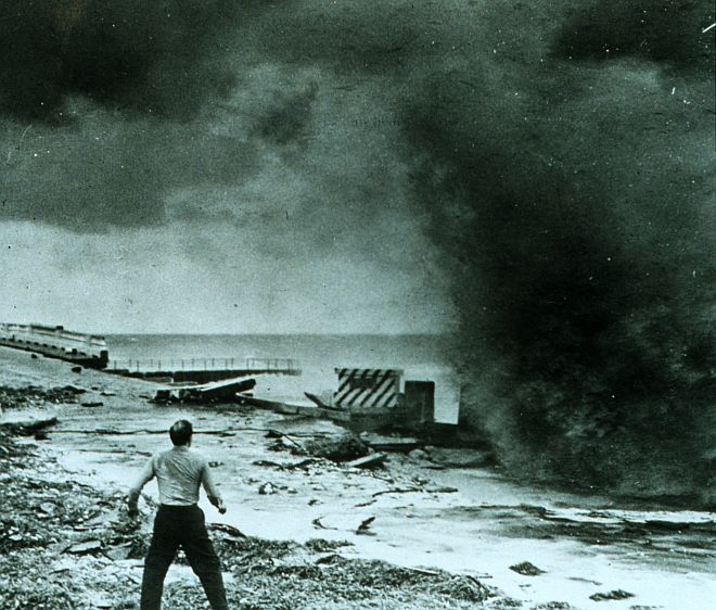 The Forceful Smashing of the Hurricane-Driven Wave Into the Seawall Demands and Receives Immediate Attention and Action - This Startled Man is Ready to Run, September 1947. Just North of Miami Beach, State of Florida, USA. Photo Credit: NOAA Central Library, National Oceanic and Atmospheric Administration Photo Library (http://www.photolib.noaa.gov, wea00411), Historic NWS Collection, National Oceanic and Atmospheric Administration (NOAA, http://www.noaa.gov), United States Department of Commerce (http://www.commerce.gov), Government of the United States of America (USA).