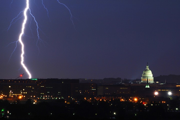 Nighttime Display of Nature's Power and the Symbol of Legislative Power -- Vivid Bolt of Lightning (left) Strikes Near the United States Capitol, Congress of the United States Building Complex (right), May 14, 2005. Washington, D.C. (District of Columbia), USA. Photo Credit: Tech. Sgt. Cherie A. Thurlby, Air Force Link - Week in Photos, May 20, 2005 (http://www.af.mil/weekinphotos/050520-10.html, 050514-F-7203T-005, 'D.C. shock'), United States Air Force (USAF, http://www.af.mil), United States Department of Defense (DoD, http://www.DefenseLink.mil or http://www.dod.gov), Government of the United States of America (USA).