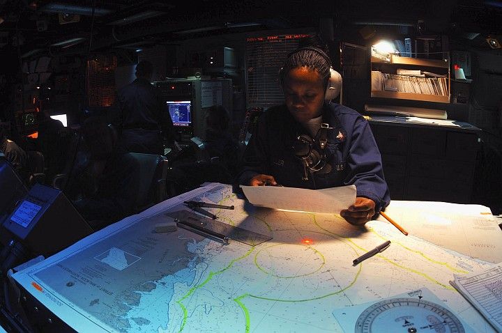 With Precision and Confidence She Plots the Course of the USS Bridge (AOE 10), September 10, 2003 in the Indian Ocean. Photo Credit: Photographer's Mate 2nd Class Monica L. McLaughlin, Navy NewsStand - Eye on the Fleet Photo Gallery (http://www.news.navy.mil/view_photos.asp, 030911-N-1671M-005), United States Navy (USN, http://www.navy.mil), United States Department of Defense (DoD, http://www.DefenseLink.mil or http://www.dod.gov), Government of the United States of America (USA).
