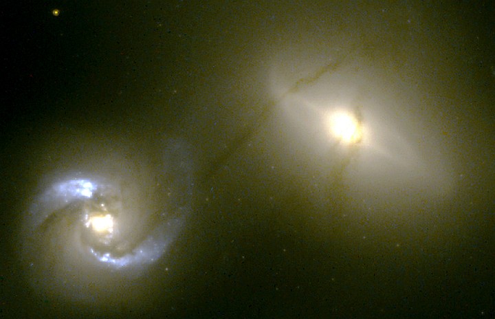 While Orbiting Each Other at 670,000 MPH (1 Million Kilometers per Hour), the Well-Defined Narrow (500 Light-years) and Very Long (20,000 Light-years) String of Material Continuously Flows Between NGC 1410 (Seyfert spiral galaxy, lower left) and NGC 1409 (upper right). Photo Credit: Intergalactic 'Pipeline' Funnels Matter Between Colliding Galaxies, October 25, 1999 (Release date: January 9, 2001), STScI-2001-02, NASA's Earth-orbiting Hubble Space Telescope (http://HubbleSite.org); William C. Keel (http://www.astr.ua.edu/keel, University of Alabama, Tuscaloosa, State of Alabama, USA), National Aeronautics and Space Administration (NASA, http://www.nasa.gov), Government of the United States of America (USA).