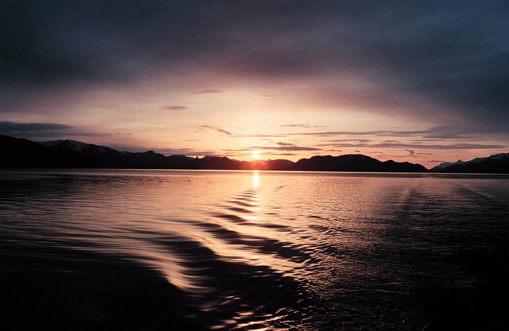 A Calming and Beautiful June 1991 Sunset Reflects Off of the Quiet Waters in Hoonah Sound, State of Alaska, USA. Photo Credit: Commander John Bortniak, NOAA Corps (ret.); National Oceanic and Atmospheric Administration Photo Library (http://www.photolib.noaa.gov, corp1777), NOAA Corps Collection, NOAA Central Library, National Oceanic and Atmospheric Administration (NOAA, http://www.noaa.gov), United States Department of Commerce (http://www.commerce.gov), Government of the United States of America (USA).
