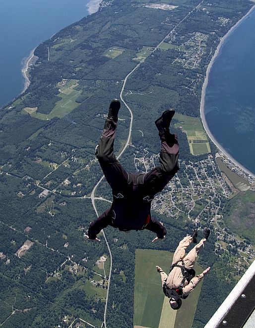 Parachutists (Parachute Jumpers) 10,000 Feet Above Whidbey Island, State of Washington, USA. Photo Credit: Photographer's Mate 3rd Class Chris Otsen, Navy NewsStand - Eye on the Fleet Photo Gallery (http://www.news.navy.mil/view_photos.asp, 050531-N-8921O-002), United States Navy (USN, http://www.navy.mil); United States Department of Defense (DoD, http://www.DefenseLink.mil or http://www.dod.gov), Government of the United States of America (USA).
