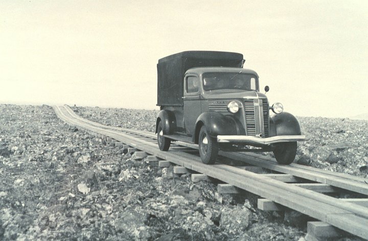 The Car Isn't On a Railroad Track, But a Narrow, One-Lane Plank (Wood) Road Constructed Over Rough Terrain, circa 1938. St. George, Pribilof Islands in the Bering Sea, State of Alaska, USA. Photo Credit: National Marine Fisheries Service; F&WS 10,067, National Oceanic and Atmospheric Administration Photo Library (http://www.photolib.noaa.gov, line1699), America's Coastlines Collection, National Oceanic and Atmospheric Administration (NOAA, http://www.noaa.gov), United States Department of Commerce (http://www.commerce.gov), Government of the United States of America (USA).