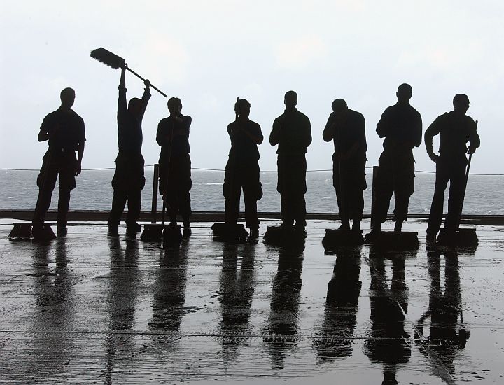 Scrubbing the USS Theodore Roosevelt's (CVN 71) Flight Decks and Catwalks With Long-Handle Brushes Removes Hydraulic Fluid, Grease and Dirt Buildup Keeps the Aircraft Carrier Safe for People and Machines, July 10, 2005 in the Atlantic Ocean. Photo Credit: Photographer's Mate Airman Sheldon Rowley, Navy NewsStand  Eye on the Fleet Photo Gallery (http://www.news.navy.mil/view_photos.asp, 050710-N-5248R-005), United States Navy (USN, http://www.navy.mil); United States Department of Defense (DoD, http://www.DefenseLink.mil or http://www.dod.gov), Government of the United States of America (USA).