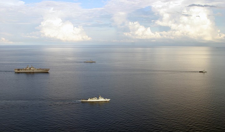 Large, White Clouds in the Blue Sky, Reflections on the Sea's Surface and Ships Navigating in Calm Waters All Combine to Create a Scenic View in the South China Sea on July 15, 2005. Photo Credit: Aviation Structural Mechanic 1st Class William Contreras, Navy NewsStand - Eye on the Fleet Photo Gallery (http://www.news.navy.mil/view_photos.asp, 050715-N-6264C-064), United States Navy (USN, http://www.navy.mil); United States Department of Defense (DoD, http://www.DefenseLink.mil or http://www.dod.gov), Government of the United States of America (USA).