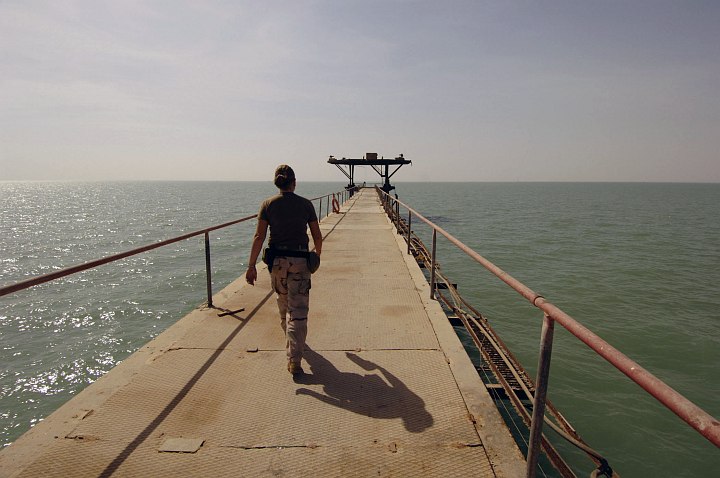 With the Waters of the Persian Gulf (North Arabian Gulf) on the Left and Right Sides, Underneath and Ahead She Confidently Walks to the Oil Terminal's Most Distant Point, June Khawr Al Amaya Oil Terminal (KAAOT), Al Jumhuriyah al Iraqiyah - Republic of Iraq. Photo Credit: Photographer's Mate 1st Class Aaron Ansarov, Navy NewsStand - Eye on the Fleet Photo Gallery (http://www.news.navy.mil/view_photos.asp, 050701-N-4309A-044), United States Navy (USN, http://www.navy.mil); United States Department of Defense (DoD, http://www.DefenseLink.mil or http://www.dod.gov), Government of the United States of America (USA).