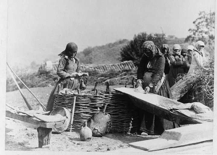 Making and Baking Bread Outdoors, circa 1888-1900, in Caucasus, Georgia (Sak'art'velo). Photo Credit: 'Women baking bread outdoors, Caucasus, Georgia (Republic)' (Card #: 92519158, Call Number: LOT 7576-5 <item> [P&P], Digital ID: cph 3c06015, http://hdl.loc.gov/loc.pnp/cph.3c06015), Prints and Photographs Online Catalog (PPOC, http://www.loc.gov/rr/print/catalog.html), Prints & Photographs Reading Room, James Guthrie Harbord Collection, The Library of Congress (LOC, http://www.loc.gov), Congress of the United States (http://www.House.gov and http://www.Senate.gov), Government of the United States of America (USA).