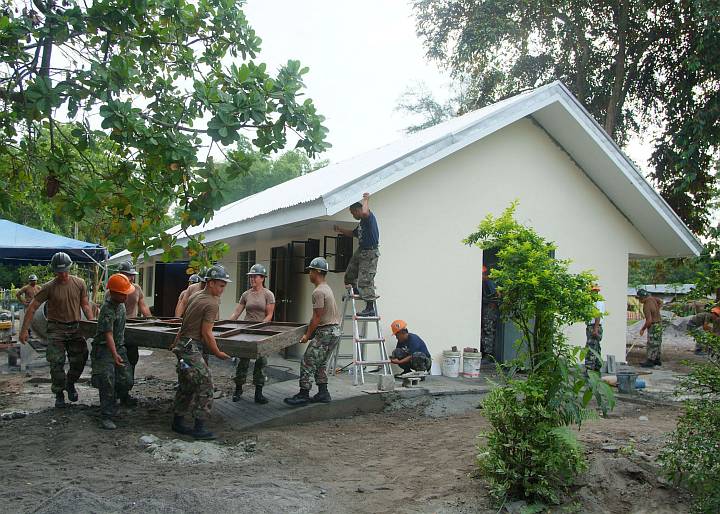 Construction Personnel From the Philippine Navy and the U.S. Navy Seabees Put the Finishing Touches on a Two-Room Schoolhouse Built at the Doce Martires Elementary School, August 19, 2005. San Narciso, Republika ng Pilipinas - Republic of the Philippines. Photo Credit: Journalist 2nd Class Brian P. Biller, Navy NewsStand - Eye on the Fleet Photo Gallery (http://www.news.navy.mil/view_photos.asp, 050819-N-4772B-009), United States Navy (USN, http://www.navy.mil), United States Department of Defense (DoD, http://www.DefenseLink.mil or http://www.dod.gov), Government of the United States of America (USA).