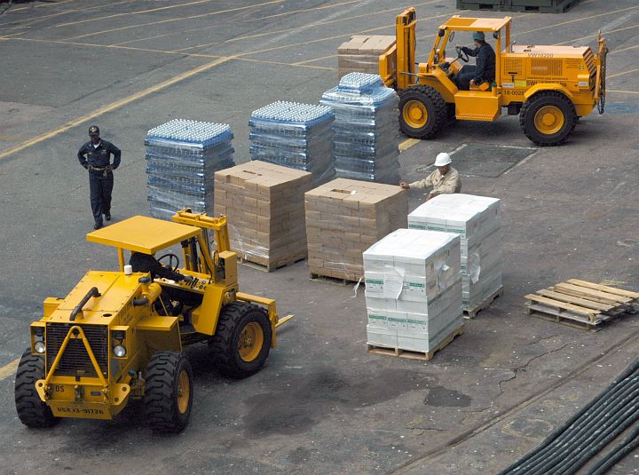 Hurricane Katrina Humanitarian Assistance, August 31, 2005: Forklifts Load Relief Supplies Onto the United States Navy Amphibious Assault Ship USS Iwo Jima (LHD 7), Naval Station Norfolk, Commonwealth of Virginia, USA. Photo Credit: Photographer's Mate 3rd Class Bradley Dawson, Navy NewsStand - Eye on the Fleet Photo Gallery (http://www.news.navy.mil/view_photos.asp, 050831-N-4781D-007), United States Navy (USN, http://www.navy.mil); United States Department of Defense (DoD, http://www.DefenseLink.mil or http://www.dod.gov), Government of the United States of America (USA).