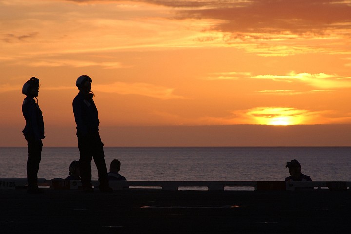 The Sun Paints the Sky in Rich, Vivid Orange Hues Before Finally Disappearing, Making an Already Beautiful Atlantic Ocean Sunset Memorable, March 3, 2004. Photo Credit: Photographer's Mate Airman Craig R. Spiering, Navy NewsStand - Eye on the Fleet Photo Gallery (http://www.news.navy.mil/view_photos.asp, 040303-N-4757S-010), United States Navy (USN, http://www.navy.mil); United States Department of Defense (DoD, http://www.DefenseLink.mil or http://www.dod.gov), Government of the United States of America (USA).