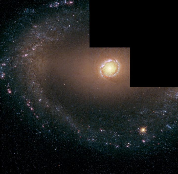 Wide View of Barred Spiral Galaxy NGC 1512 and Its Spectacular Circumnuclear Starburst Ring, Located in the Southern Constellation of Horologium. Photo Credit: Hubble Unveils a Galaxy in Living Color, July 18, 1993, July 29, 1998, and March 5, 1999 (Release date: May 31, 2001), STScI-2001-16, NASA's Earth-orbiting Hubble Space Telescope (http://HubbleSite.org); European Space Agency (ESA, http://SpaceTelescope.org), Dan Maoz (Tel-Aviv University, Israel and Columbia University, USA), National Aeronautics and Space Administration (NASA, http://www.nasa.gov), Government of the United States of America (USA). Members of the group of scientists involved in these observations are: Dan Maoz (Tel-Aviv University, Israel and Columbia University, USA), Aaron J. Barth (Harvard-Smithsonian Center for Astrophysics, USA), Luis C. Ho (The Observatories of the Carnegie Institution of Washington, USA), Amiel Sternberg (Tel-Aviv University, Israel) and Alexei V. Filippenko (University of California, Berkeley, USA).