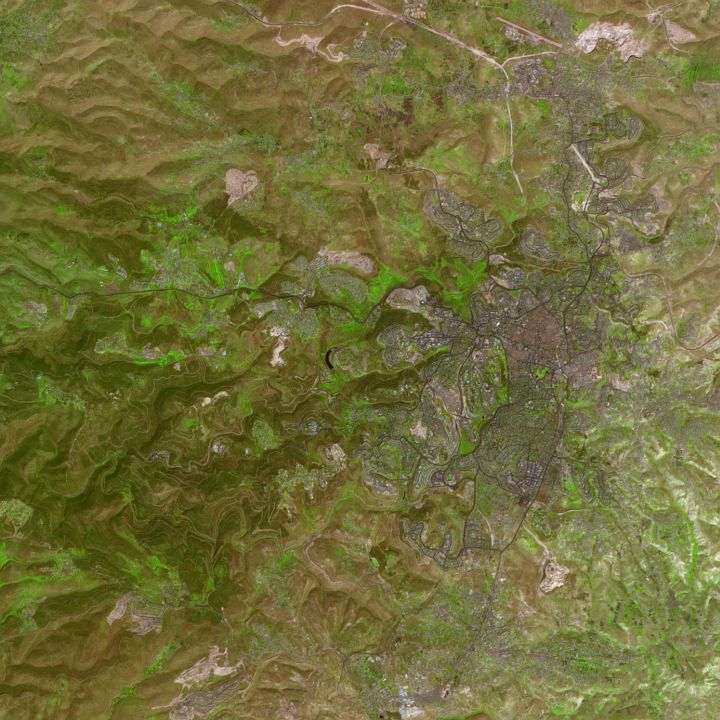 This False-color ASTER Image Shows the Historic and Very, Very Old City of Jerusalem in Shades of Purple, NASA's Terra Satellite, April 3, 2000.  Decoding (or Interpreting the Colors). Purple: Developed Areas; Green: Vegetation; Deep Blue or Black: Water; Pinkish-brown: Naturally Bare or Thinly Vegetated. Photo Credit: Jesse Allen, NASA's Earth Observatory; NASA's Terra satellite (http://terra.nasa.gov): Advanced Spaceborne Thermal Emission and Reflection Radiometer (ASTER, http://asterweb.jpl.nasa.gov), Earth Observatory (EO) Newsroom: New Images - Jerusalem, National Aeronautics and Space Administration (NASA, http://www.nasa.gov), Government of the United States of America.
