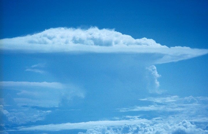 Surrounded by the Blue Sky, The Perfect Thunderstorm Impressively Towers Above the Clouds, October 6, 1972 at 18:45 UTC. Photo Credit: NOAA/AOML/Hurricane Research Division, National Oceanic and Atmospheric Administration Photo Library (http://www.photolib.noaa.gov, fly00890), Flying with NOAA Collection, NOAA Central Library, National Oceanic and Atmospheric Administration (NOAA, http://www.noaa.gov), United States Department of Commerce (http://www.commerce.gov), Government of the United States of America (USA).