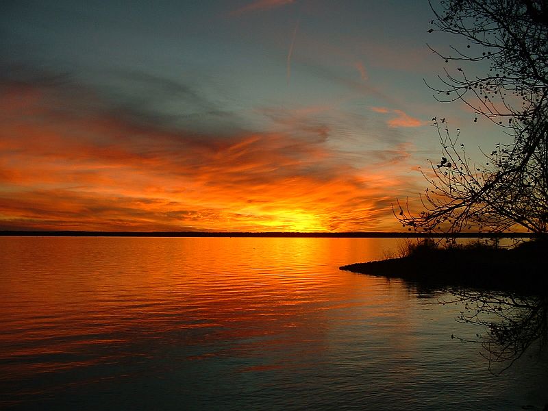 A Colorful and Gorgeous Sunset Over and Reflected On Lake Marion, Santee National Wildlife Refuge, State of South Carolina, USA. Photo Credit: Ginger L. Corbin, Southeast Image Library, United States Fish and Wildlife Service Digital Library System (http://images.fws.gov, personal slide), United States Fish and Wildlife Service (FWS, http://www.fws.gov), United States Department of the Interior (http://www.doi.gov), Government of the United States of America (USA).
