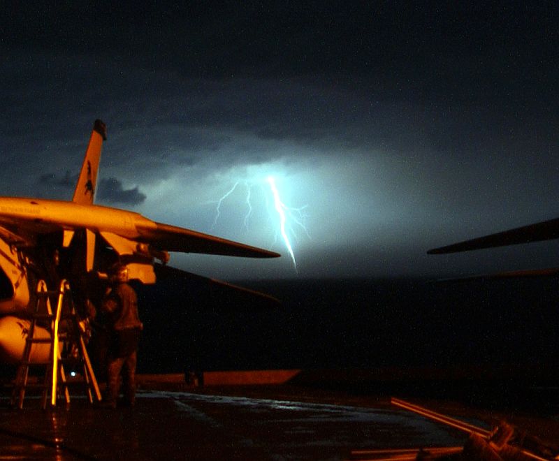 Bright, Hot, Vivid, and Intense Lightning Strike In the Distance, November 13, 2005, United States Navy USS Theodore Roosevelt (CVN 71), Persian Gulf. Photo Credit: Photographer's Mate Airman Javier Capella, Navy NewsStand - Eye on the Fleet Photo Gallery (http://www.news.navy.mil/view_photos.asp, 051113-N-0685C-001), United States Navy (USN, http://www.navy.mil), United States Department of Defense (DoD, http://www.DefenseLink.mil or http://www.dod.gov), Government of the United States of America (USA).