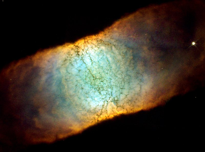 Side View of the Beautiful, and Highly Symmetrical, Bipolar Planetary Nebula IC 4406, Also Known as 'The Retina Nebula', Located in the Constellation Lupus. Photo Credit: The Retina Nebula: Dying Star IC 4406, June 28, 2001 and January 19, 2002 (Release date: June 13, 2002), STScI-2002-14, NASA's Earth-orbiting Hubble Space Telescope (http://HubbleSite.org); The Hubble Heritage Team (STScI/AURA), National Aeronautics and Space Administration (NASA, http://www.nasa.gov), Government of the United States of America (USA). Acknowledgment: C.R. O'Dell (Vanderbilt University).