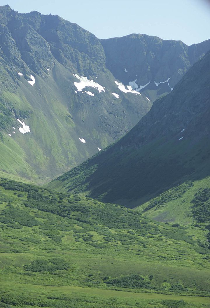 Foliage-Covered Valleys and Slopes in Shades of Green, Patches of White Snow Here and There, Mountain Peaks Reaching Boldly Into the Blue Sky -- This Grand View of the Mountains in Togiak National Wildlife Refuge (Togiak NWR 037) Is a Portrait of Power, Beauty, Strength and Majesty, State of Alaska, USA. Photo Credit: Steve Hillebrand, Alaska Image Library, United States Fish and Wildlife Service Digital Library System (http://images.fws.gov, DI-W5B0037TO), United States Fish and Wildlife Service (FWS, http://www.fws.gov), United States Department of the Interior (http://www.doi.gov), Government of the United States of America (USA).