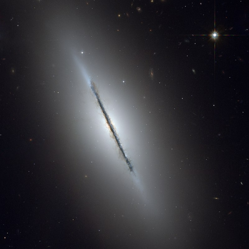 Edge-on View of Lenticular Galaxy NGC 5866, a Disk Galaxy Classified as Type S0 (S Zero) in the Constellation Draco. Photo Credit: ACS Image of NGC 5866, February 11, 2006 (Release date: June 8, 2006), STScI-2006-24, NASA's Earth-orbiting Hubble Space Telescope (http://HubbleSite.org); The Hubble Heritage Team (STScI/AURA), European Space Agency (ESA, http://SpaceTelescope.org), National Aeronautics and Space Administration (NASA, http://www.nasa.gov), Government of the United States of America (USA). Acknowledgment: W. Keel (University of Alabama, Tuscaloosa).