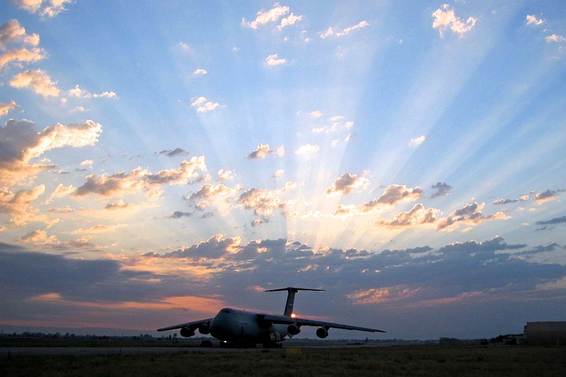 A Beautiful Sunset. The Huge C-5 Galaxy Oversize Cargo Transport Is With United States Air Force Reserve Command 433rd Airlift Wing. Photo Credit: Captain Jeremy Angel, United States Air Force; Air Force Link - Week in Photos, March 10, 2006 (http://www.af.mil/weekinphotos/060310-10.html and http://www.af.mil/weekinphotos/wipgallery.asp?week=158, 060309-F-7692M-111, "C-5 at Sunset"), United States Air Force (USAF, http://www.af.mil), United States Department of Defense (DoD, http://www.DefenseLink.mil or http://www.dod.gov), Government of the United States of America (USA).