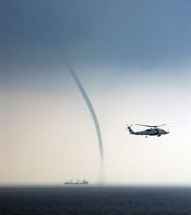 Tornado Over Water -- a Waterspout -- In the South China Sea, September 5, 2004, Off the Coast of Malaysia. Photo Credit: Photographer's Mate Airman Richard R. Waite, Navy NewsStand - Eye on the Fleet Photo Gallery (http://www.news.navy.mil/view_photos.asp, 040905-N-1513W-085), United States Navy (USN, http://www.navy.mil), United States Department of Defense (DoD, http://www.DefenseLink.mil or http://www.dod.gov), Government of the United States of America (USA).