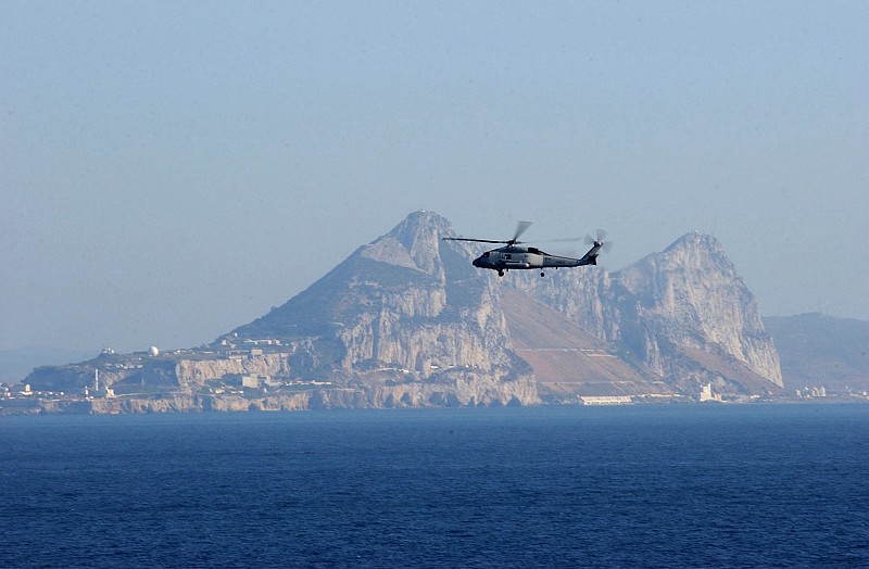 The Rock of Gibraltar, Located on Gibraltar, as Seen From the Strait of Gibraltar (Straits of Gibraltar), July 10, 2004. Gibraltar, Overseas Territory of the United Kingdom of Great Britain and Northern Ireland. Photo Credit: Photographer's Mate Airman Lilliana LaVende, Navy NewsStand - Eye on the Fleet Photo Gallery (http://www.news.navy.mil/view_photos.asp, 040710-N-2805L-034), United States Navy (USN, http://www.navy.mil), United States Department of Defense (DoD, http://www.DefenseLink.mil or http://www.dod.gov), Government of the United States of America (USA).