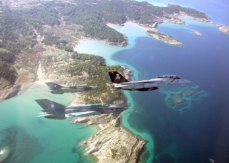 Beautiful Aerial View of Croatia and the Adriatic Sea, November 1, 2002, Republika Hrvatska - Republic of Croatia. Also Visible Are a United States Navy F-14 Tomcat Jet Fighter, Assigned to the "Jolly Rogers" of Fighter Squadron One Zero Three (VF-103), Flying in Formation With Two Zrakoplovstvo Nezavisna Drzava Hrvatska (Zrakoplovstvo NDH) -- Croatian Air Force -- MiG-21 "Fishbed" Fighter Jets During the "Joint Wings 2002" Exercise.Photo Credit: Capt. Dana Potts, Navy NewsStand - Eye on the Fleet Photo Gallery (http://www.news.navy.mil/view_photos.asp, 021101-N-1955P-001), United States Navy (USN, http://www.navy.mil), United States Department of Defense (DoD, http://www.DefenseLink.mil or http://www.dod.gov), Government of the United States of America (USA).