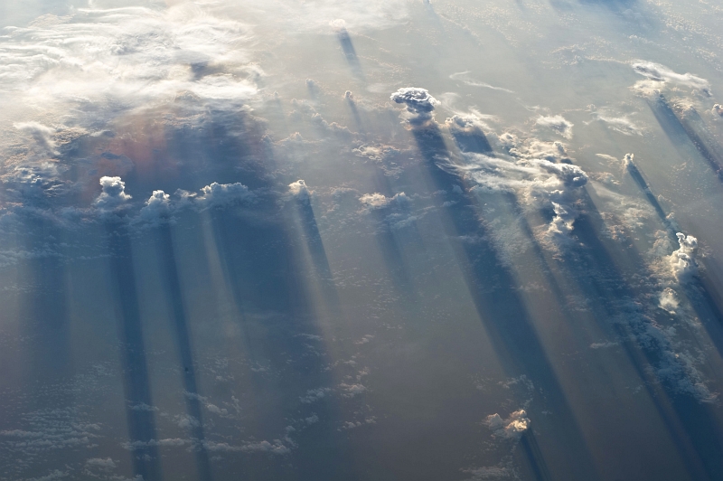 45. Clouds and Their Long Shadows, May 19, 2011 at 12:20:26 GMT, As Seen From the International Space Station (Expedition Twenty-Seven) While Over the North Pacific Ocean, West of Mexico: Latitude (LAT): 14.3, Longitude (LON): -102.4, Altitude (ALT): 185 Nautical Miles (nm), Sun Azimuth (AZI): 69 degrees, Sun Elevation Angle (ELEV):  -1 degrees. Photo Credit: NASA; ISS027-E-35995, International Space Station (Expedition 27); Image Science and Analysis Laboratory, NASA-Johnson Space Center. 'Astronaut Photography of Earth - Display Record.' <http://eol.jsc.nasa.gov/scripts/sseop/photo.pl?mission=ISS027&roll=E&frame=35995>; National Aeronautics and Space Administration (NASA, http://www.nasa.gov), Government of the United States of America (USA).