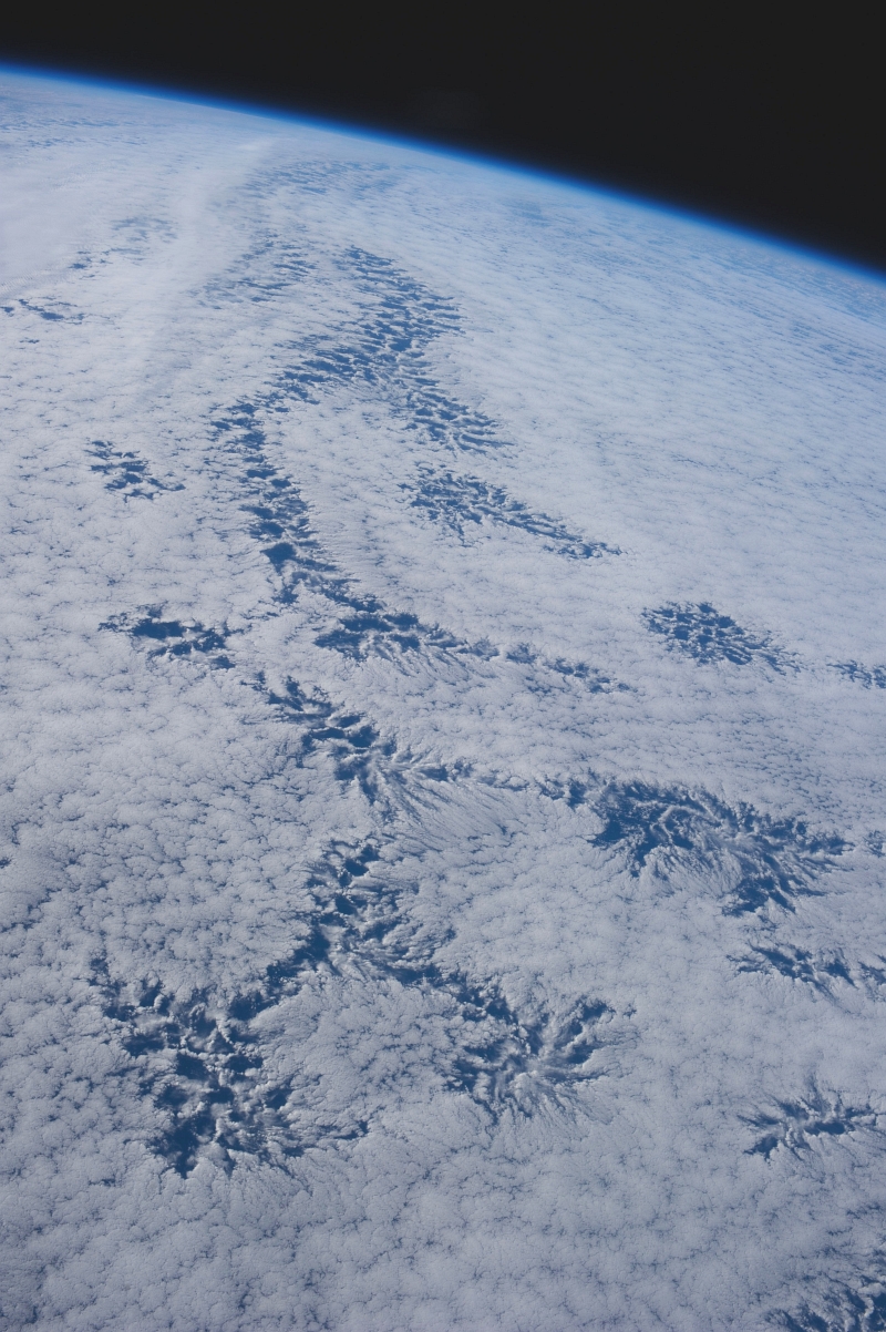48b. Cloud Patterns, July 26, 2013 at 20:40:40 GMT, As Seen From the International Space Station (Expedition 36) While Orbiting Over the South Pacific Ocean, Latitude (LAT): -43.9, Longitude (LON): -113.9, Altitude (ALT): 226 Nautical Miles, Sun Azimuth (AZI): 345 degrees, Sun Elevation Angle (ELEV): 26 degrees. Photo Credit: NASA; ISS036-E-25842, International Space Station (Expedition 36); Image Science and Analysis Laboratory, NASA-Johnson Space Center. 'The Gateway to Astronaut Photography of Earth.' <http://eol.jsc.nasa.gov/scripts/sseop/photo.pl?mission=ISS036&roll=E&frame=25842>; National Aeronautics and Space Administration (NASA, http://www.nasa.gov), Government of the United States of America (USA).