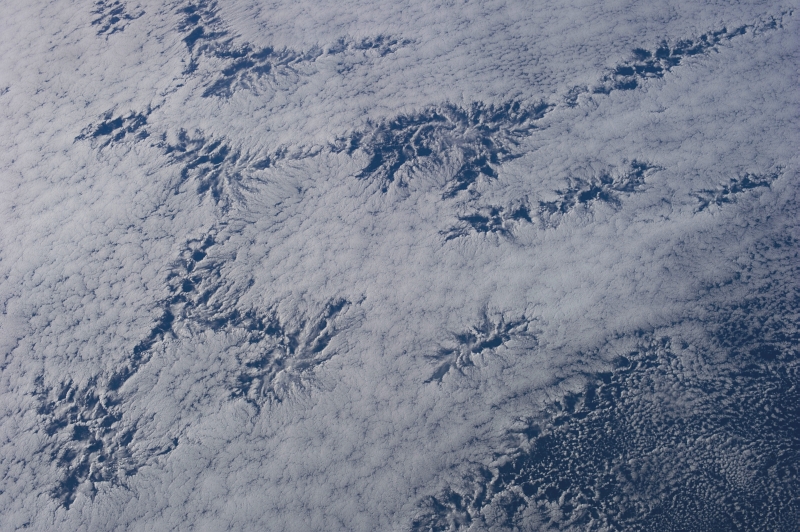 48d. Cloud Patterns, July 26, 2013 at 20:41:22 GMT, As Seen From the International Space Station (Expedition 36) While Orbiting Over the South Pacific Ocean, Latitude (LAT): -45.2, Longitude (LON): -110.8, Altitude (ALT): 226 Nautical Miles, Sun Azimuth (AZI): 342 degrees, Sun Elevation Angle (ELEV): 24 degrees. Photo Credit: NASA; ISS036-E-25844, International Space Station (Expedition 36); Image Science and Analysis Laboratory, NASA-Johnson Space Center. 'The Gateway to Astronaut Photography of Earth.' <http://eol.jsc.nasa.gov/scripts/sseop/photo.pl?mission=ISS036&roll=E&frame=25844>; National Aeronautics and Space Administration (NASA, http://www.nasa.gov), Government of the United States of America (USA).