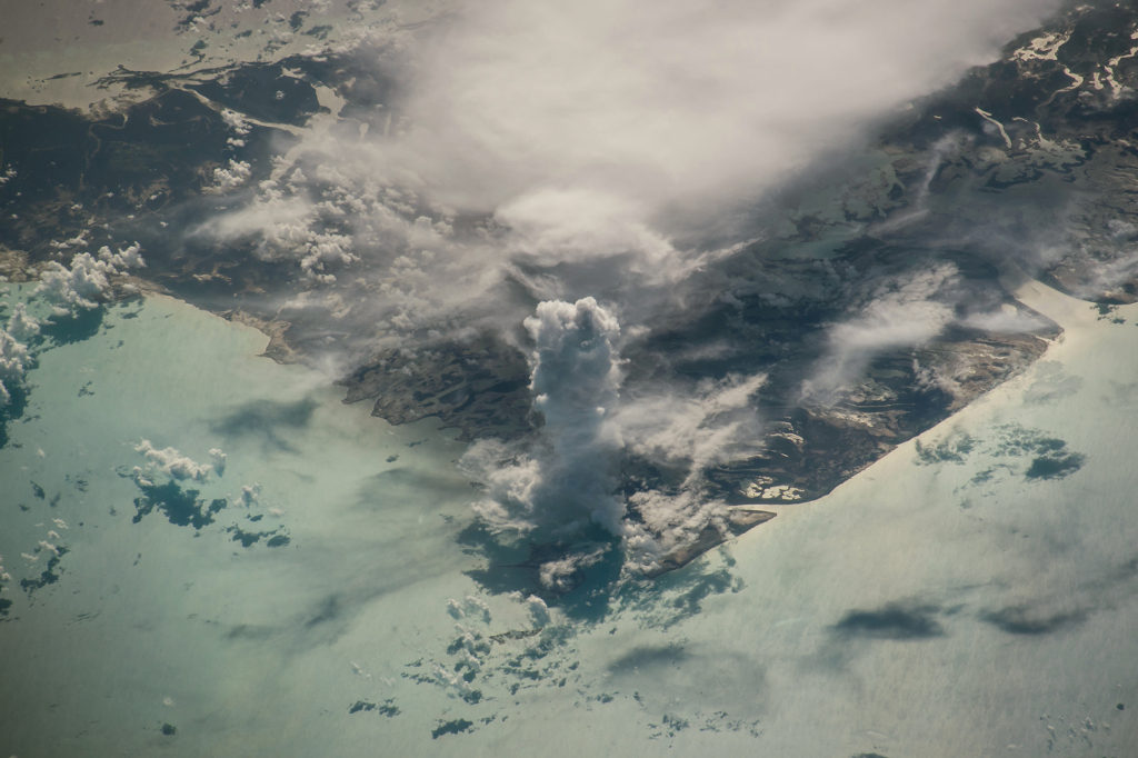 49. A Huge, Very Tall, Vertical, Pillar of A Cloud: One Cumulus Castellanus Over Andros Island, 19 July 2016 at 13:30:14 GMT, Commonwealth of The Bahamas, United Kingdom of Great Britain and Northern Ireland, As Seen From the International Space Station (Expedition 36) While Orbiting Over the Gulf of Mexico, International Space Station (ISS) Nadir Latitude: 23.4, ISS Nadir Longitude: -83.7, Altitude: 216 Nautical Miles, Sun Azimuth: 79 degrees, Sun Elevation Angle: 32 degrees, Photo Center Point Latitude: 24.7, Photo Center Point Longitude: -78.3, Nadir to Photo Center: East. Photo Credit: NASA; ISS048-E-38518, International Space Station (Expedition 48); Billy Island, Williams Island, Andros Island, castle cloud; Image courtesy of the Earth Science and Remote Sensing Unit, NASA Johnson Space Center, https://eol.jsc.nasa.gov. National Aeronautics and Space Administration (NASA, http://www.nasa.gov), Government of the United States of America (USA).