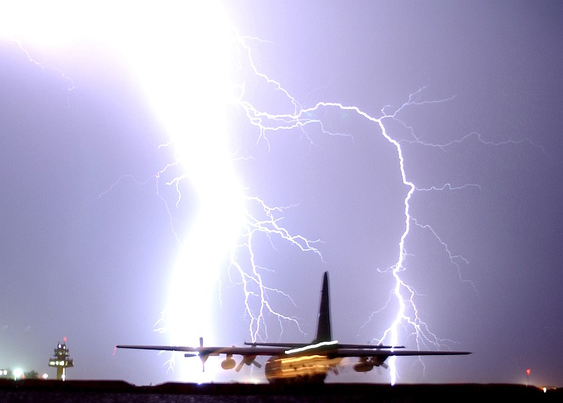 1. This Storm Generates a Very Powerful, Intense, Massive, Bright, Column-Shaped, and Hot Lightning Bolt That Strikes Near the Airport's Control Tower and a Taxiing C-130 Hercules Aircraft, May 16, 2006, Balad Air Base, Al Jumhuriyah al Iraqiyah - Republic of Iraq. Photo Credit: Senior Airman James Croxon, Air Force Link - Photos (http://www.af.mil/photos, 060516-F-0185C-001, Nature's firework), United States Air Force (USAF, http://www.af.mil), United States Department of Defense (DoD, http://www.DefenseLink.mil or http://www.dod.gov), Government of the United States of America (USA).