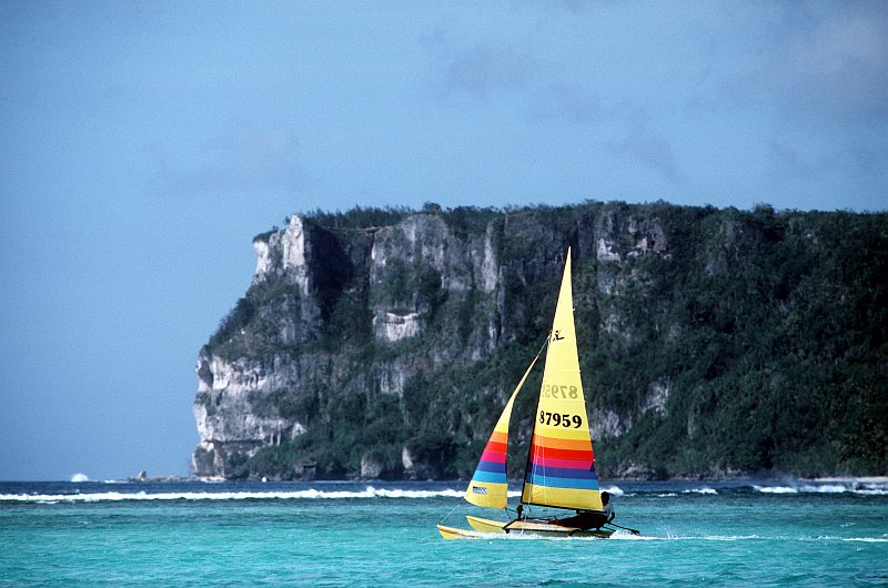 Blue Sky, Warm Tropical Weather, and Turquoise Waters: It's a Beautiful Day For Sailing in the Vicinity of Two Lovers Point, April 8, 1985. Tumon Bay, Territory of Guam, USA. Photo Credit: CM Sgt. Don Sutherland, United States Air Force; Defense Visual Information Center (DVIC, http://www.DoDMedia.osd.mil, DFST9006482) and United States Air Force (USAF, http://www.af.mil), United States Department of Defense (DoD, http://www.DefenseLink.mil or http://www.dod.gov), Government of the United States of America (USA).