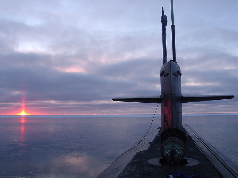 Beautiful and Scenic View of the Sky, the Sun (Sunrise or Sunset), and the Horizon at the Arctic Circle, October 2003. Photo Credit (Full size): Chief Yeoman Alphonso Braggs, Navy NewsStand - Eye on the Fleet Photo Gallery (http://www.news.navy.mil/view_photos.asp, 031000-N-XXXXB-005), United States Navy (USN, http://www.navy.mil), United States Department of Defense (DoD, http://www.DefenseLink.mil or http://www.dod.gov), Government of the United States of America (USA).