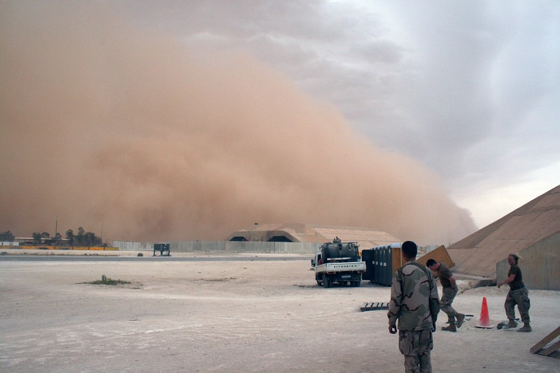 6. In Broad Daylight this Sandstorm, an Enormous Mountain of Sand and an Awesome Display of Nature's Wind Power, Approaches the Base and Engulfs the Hardened Aircraft Shelter, May 21, 2007, Al Asad, Al Anbar Province, Al Jumhuriyah al Iraqiyah - Republic of Iraq Photo Credit: Senior Chief Aviation Structural Mechanic Andrew Stack, United States Marine Corps (USMC, http://www.usmc.mil); Navy NewsStand - Eye on the Fleet Photo Gallery (http://www.news.navy.mil/view_photos.asp, 070521-N-0000X-021), United States Navy (USN, http://www.navy.mil), United States Department of Defense (DoD, http://www.DefenseLink.mil or http://www.dod.gov), Government of the United States of America (USA).