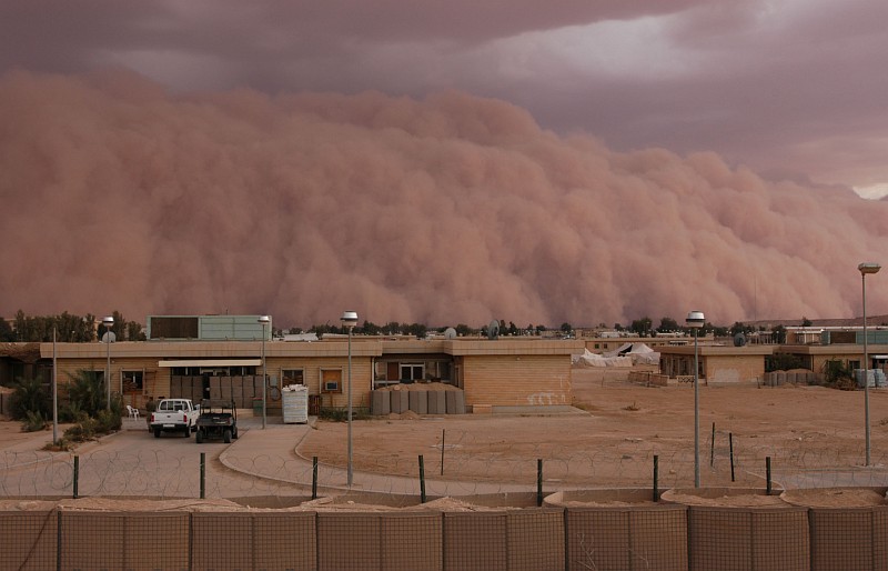 7. A Spectacular and Ominous View of an Approaching Sandstorm, an Unstoppable, Gigantic, Rolling Wall of Sand Between 4,000 and 5,000 Feet In Height, April 26, 2005, Al Asad, Al Anbar Province, Al Jumhuriyah al Iraqiyah - Republic of Iraq. Photo Credit: Gunnery Sgt. Shannon Arledge, 2nd Marine Aircraft Wing, USMC; Official Photo Archive - U.S. Marine Corps, Photo ID# :2005426141735 and 20050426-M-0502A-018, Marine Corps Photo Gallery (http://www.usmc.mil/marinelink/image1.nsf/imagearchive), United States Marine Corps (USMC, http://www.usmc.mil), United States Department of Defense (DoD, http://www.DefenseLink.mil or http://www.dod.gov), Government of the United States of America (USA). See the Marine Corps News story 'Dust in the wind: A wall of sand moves through Al Asad' by USMC Gunnery Sgt. Shannon Arledge, 2nd Marine Aircraft Wing, April 26, 2005 (Story ID#: 2005426134811, http://www.usmc.mil/marinelink/mcn2000.nsf/lookupstoryref/2005426134811).