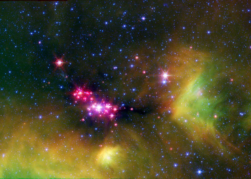 Infrared, False-color View of the Glowing Stars of Serpens Cluster A, Constellation Serpens. Photo Credit: Seeing Stars in Serpens, sig06-026, April 5th, 2004 (IRAC) and April 6th, 2004 (MIPS) (Release date: October 24, 2006), NASA's Spitzer Space Telescope (http://www.spitzer.caltech.edu); NASA/JPL-Caltech/Lucas Cieza (University of Texas at Austin), National Aeronautics and Space Administration (NASA, http://www.nasa.gov), Government of the United States of America (USA).